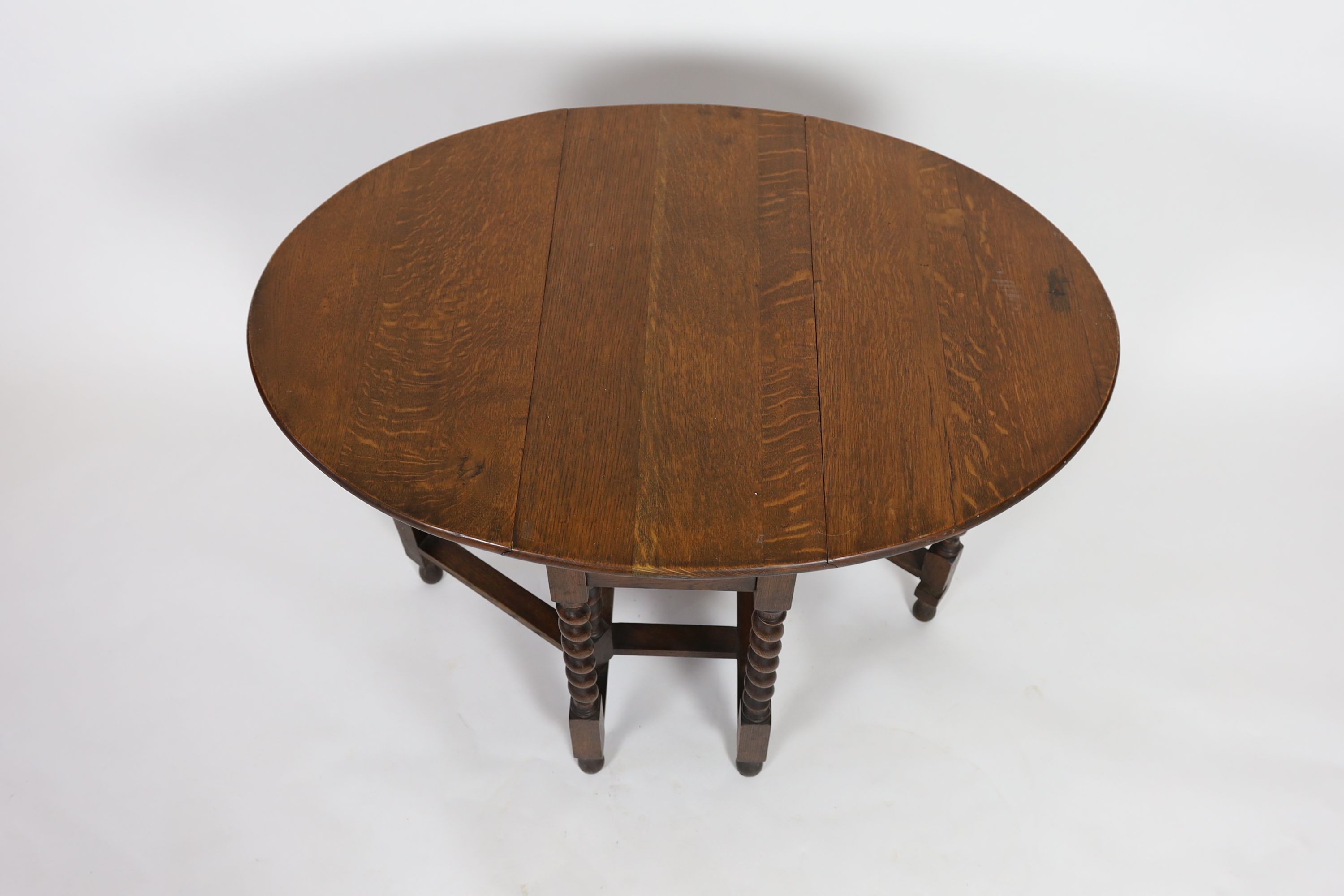 A small early 20th century oak gateleg table, on spiral turned legs, width 77cm depth 37cm height 74cm